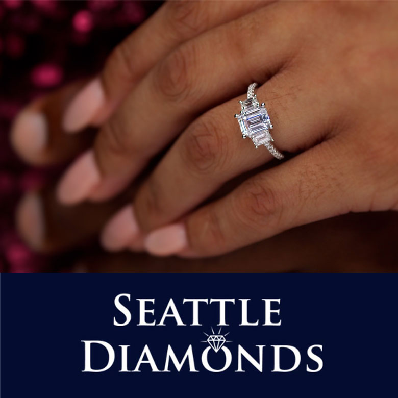 Seattle Diamonds logo and image of diamond ring on manicured hand